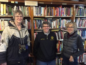 Barbara Kessel, Tracy Engelson, and Jamie Storm meet at Books to Prisoners to set up library at Stateville      